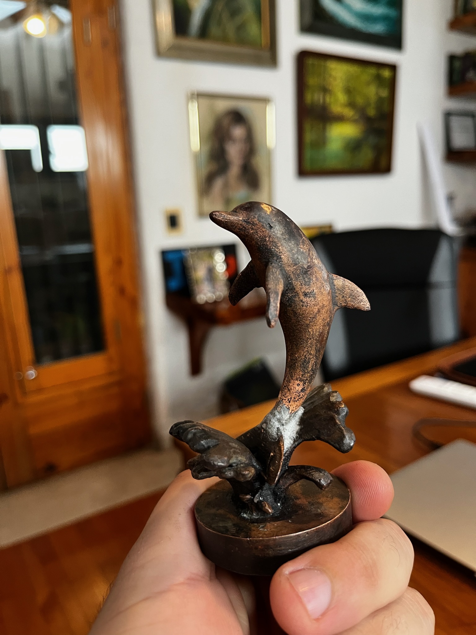 Cast bronze dolphin sculpture